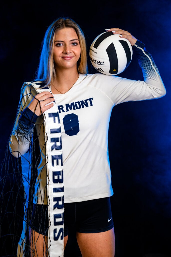 Fairmont High School Senior volleyball player poses for her senior portraits with her uniform at Trent Arena in Kettering, Ohio with Studio 22 Photography.